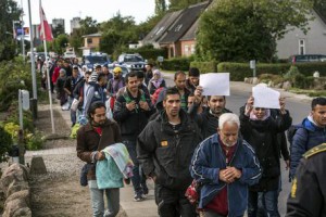 Middle Eastern migrants, who came from Germany by ferry and train Sunday night, and are walking  from Rodby in southern Denmark towards Sweden on Monday Sept. 7, 2015. Most of the migrants came from Syria, and  wished to continue to Sweden where they will seek asylum. The distance from Rodby to the Oresundsbron in  Sweden is 180 kilometres. (ANSA/AP Photo/POLFOTO, Per Rasmussen)  DENMARK OUT