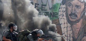 Israeli soldiers keep their position during clashes with Palestinian stone throwers at the Qalandia checkpoint between the West Bank city of Ramallah and Jerusalem on September 21, 2011. AFP PHOTO/AHMAD GHARABLI (Photo credit should read AHMAD GHARABLI/AFP/Getty Images)